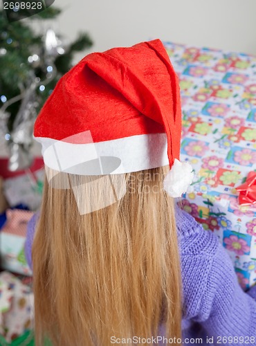 Image of Rear View Of Girl With Christmas Gift