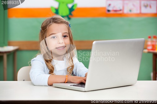 Image of Girl Using Laptop In Classroom