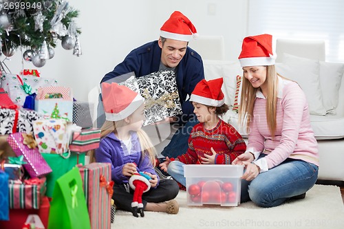 Image of Family With Christmas Gifts And Decorations