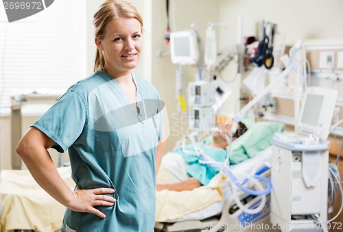 Image of Confident Nurse With Patient Resting In Hospital