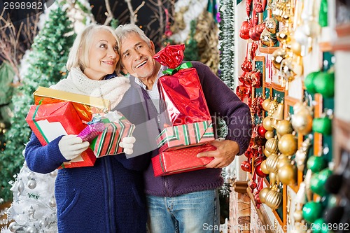 Image of Couple Shopping In Christmas Store