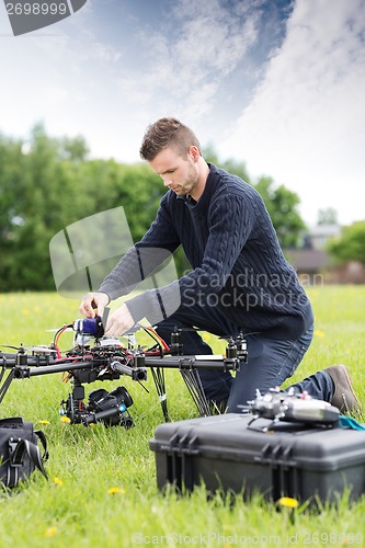 Image of Young Engineer Assembling UAV