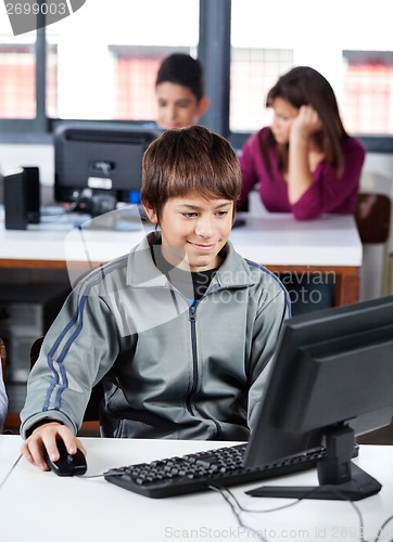 Image of Schoolboy Using Computer In Lab