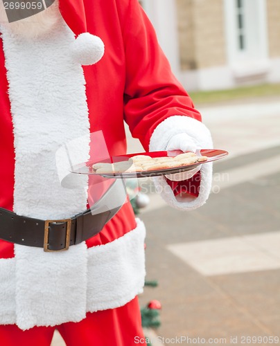 Image of Santa Claus Holding Plate With Cookies