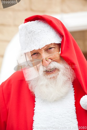 Image of Senior Man Dressed As Santa Claus