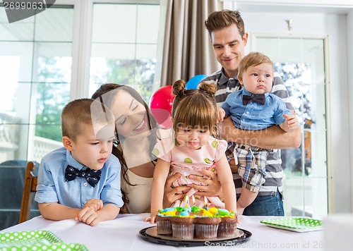 Image of Family Celebrating Girl's Birthday