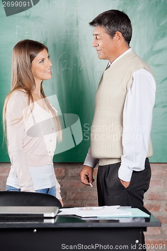 Image of Student And Teacher Looking At Each Other In Classroom