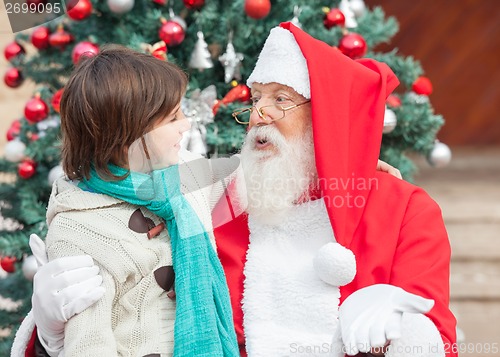 Image of Boy And Santa Claus Looking At Each Other