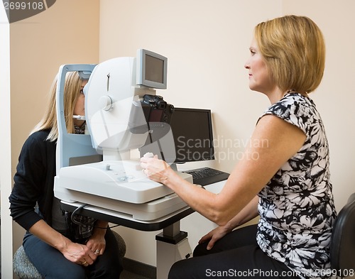 Image of Optometrist Using Digital Retina Camera