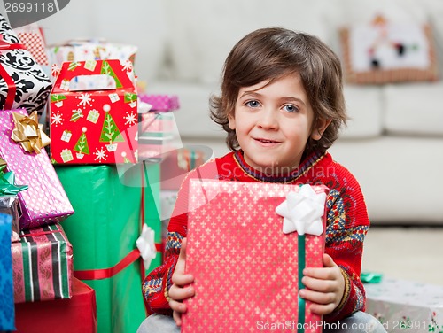 Image of Cute Boy With Holding Christmas Present