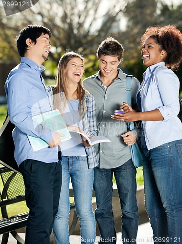 Image of Happy Students Standing In Campus