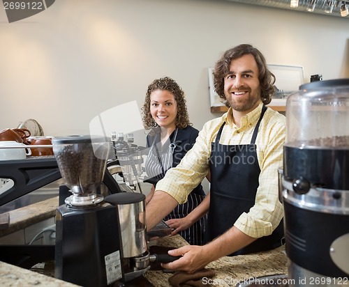 Image of Colleagues Working In Coffeeshop