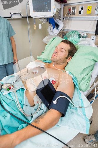 Image of Patient With Holter Monitor Sleeping In Examination Room