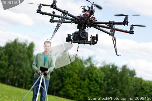 Image of Technician Operating UAV Octocopter