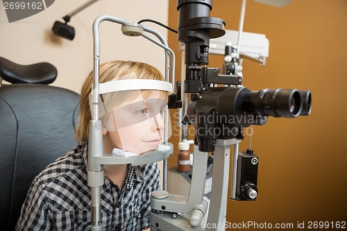 Image of Boy Undergoing Eye Examination With Slit Lamp