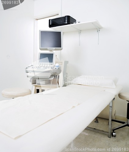 Image of Examination Room With Bed And Ultrasound Machine