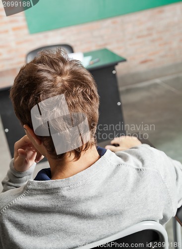 Image of Male Student Sitting In Classroom