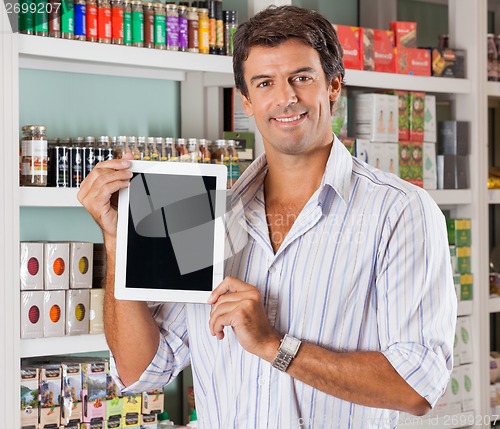 Image of Man Showing Tablet In Grocery Store