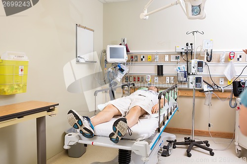 Image of Patient Lying On Bed In Hospital Room