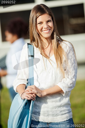 Image of Happy Woman Carrying Shoulder Bag Standing On Campus