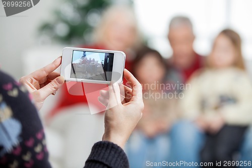 Image of Mother Photographing Family Through Smartphone