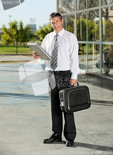Image of College Professor With Books And Bag At Campus