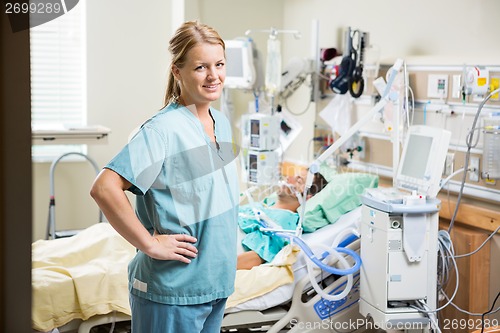 Image of Confident Nurse With Patient Resting In Hospital