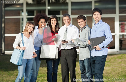 Image of Happy Students With Teacher Standing On College Campus