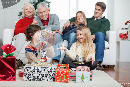 Image of Family With Christmas Presents At Home