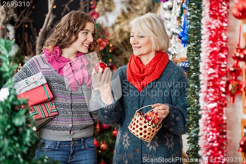 Image of Happy Mother And Daughter In Christmas Store