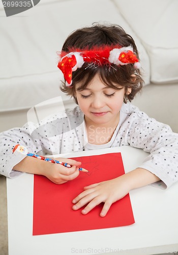 Image of Boy Making Christmas Greeting Card
