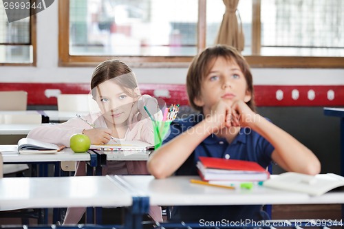 Image of Schoolgirl Looking At Schoolboy