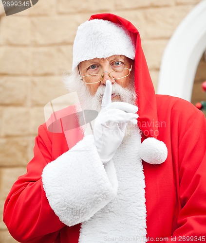 Image of Santa Claus With Finger On Lips