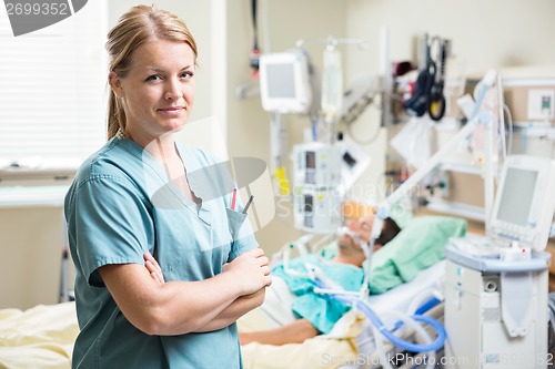 Image of Confident Nurse With Patient Resting In Hospital