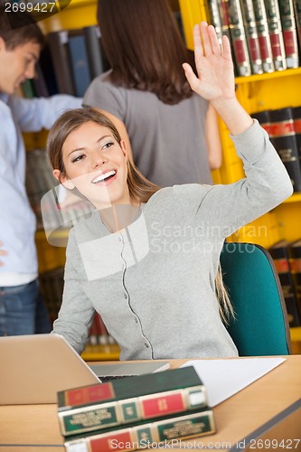 Image of Student With Laptop And Books Waving In Library