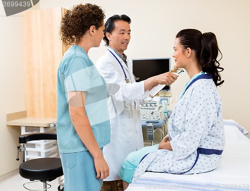 Image of Doctor Examining Patient In Ultrasound Room