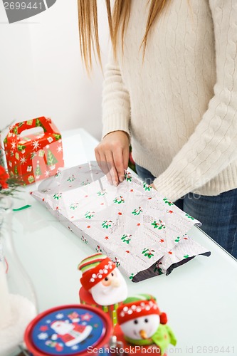 Image of Woman Packing Christmas Gifts