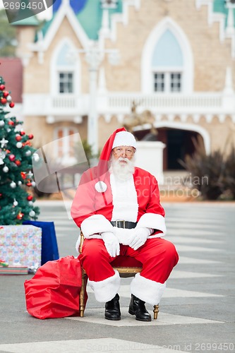 Image of Santa Claus Sitting In Courtyard