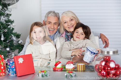 Image of Children And Grandparents With Christmas Gifts