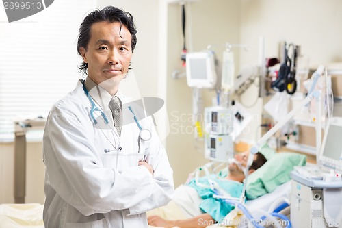 Image of Confident Doctor With Patient Resting In Background