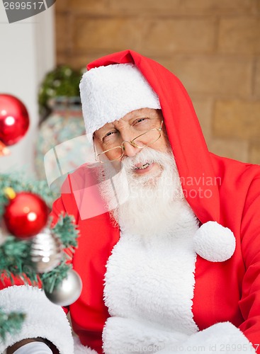 Image of Man Dressed As Santa Claus Outside House
