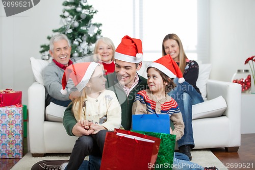 Image of Multigeneration Family With Christmas Presents