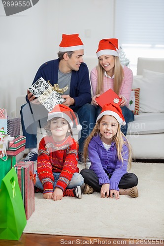 Image of Children With Parents At Home During Christmas