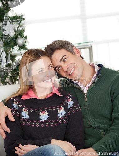 Image of Loving Couple At Home During Christmas