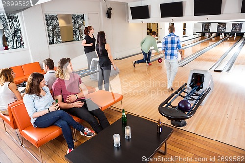 Image of People Having Leisure Time At Bowling Club