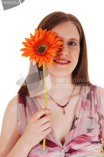 Image of Girl holding flower.