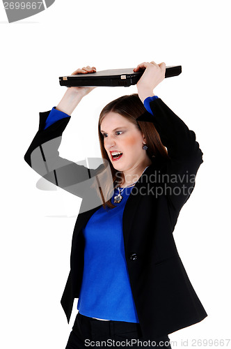 Image of Woman throwing laptop.