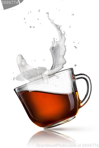 Image of cup of black tea with milk splash isolated on white