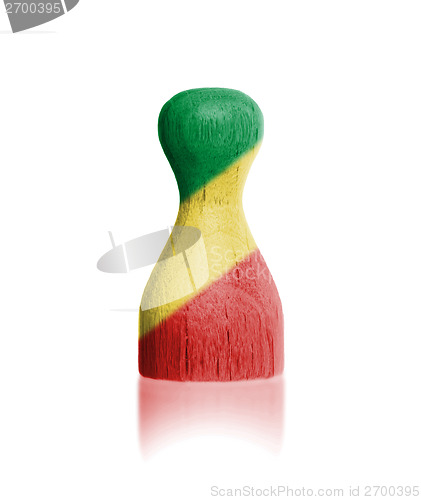 Image of Wooden pawn with a painting of a flag