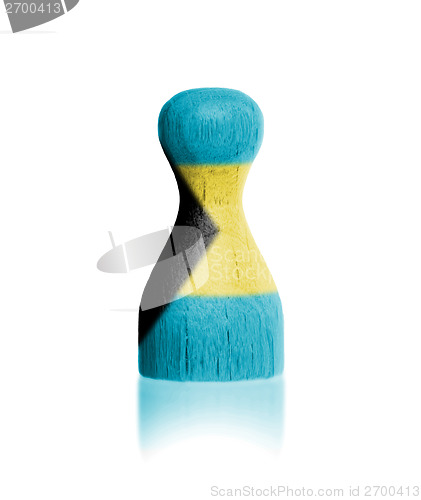 Image of Wooden pawn with a painting of a flag